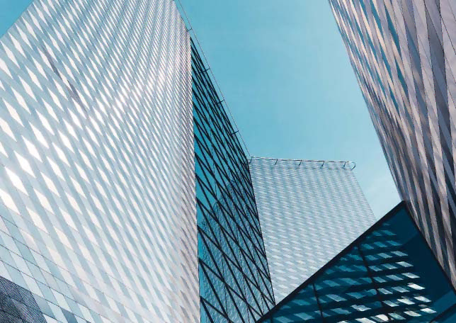 Modern skyscrapers reflecting the sky, symbolizing growth and innovation, related to TechnicaX's expertise in Microsoft Dynamics 365 solutions in the USA. 